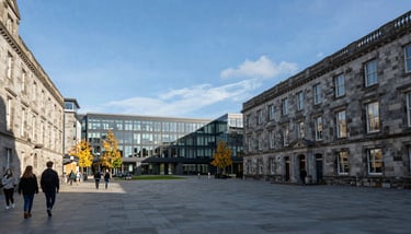 A group of diverse students celebrating graduation, throwing caps in the air, bright and joyous atmosphere with steel blue and navy colors.