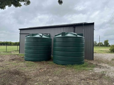 Green Water Storage behind Metal Shed