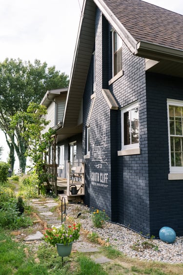 South Cliff Inn side yard with painted logo