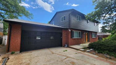 Modern exterior house painting on dark siding and brick by Pellucos Painting