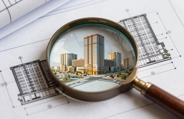 A close-up of a detailed architectural blueprint of a modern commercial complex with a magnifying glass over it. The lighting is sharp, professional, and incorporates deep amber highlights. #C04E01 accents.