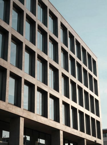 A modern building facade in the business district of Courbevoie, clean architectural lines under a clear sky.