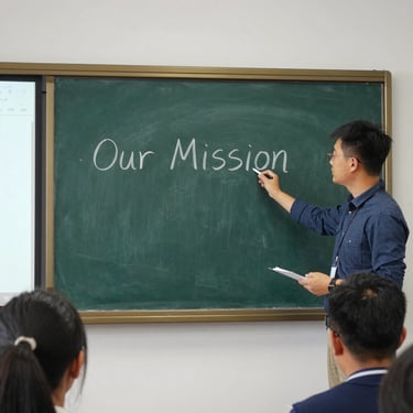 Close-up of hands typing on a laptop with graphs and data charts visible on the screen.