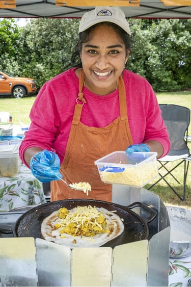 Aroha Dosas serving customers at the Glenbrook Christmas event, Frankline Times Photo