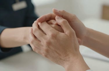 Close up of two hands joined in a supportive gesture, soft natural skin tones, Western European setting, professional and empathetic vibe.