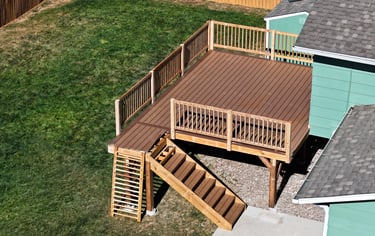 Aerial overview of finished multi-level wood deck and stairs by Brewer Construction in Denver.
