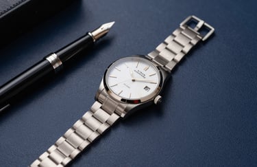 Clean, minimalist shot of a luxury watch and a fountain pen on a dark blue leather surface. Represents precision and high-level business execution. Soft golden light highlights.