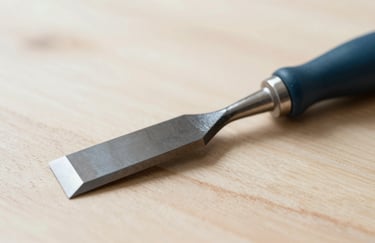 A minimalist studio shot of natural wood textures and a professional chisel tool, incorporating #2C4D5B and #EBF2F4, focused on artisan repair quality.