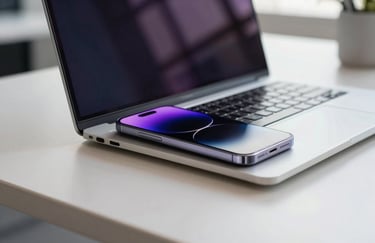 Close up photography of a high-end smartphone and sleek laptop on a minimalist desk in a bright corporate office in Madrid. Iberian / Spanish light. Touches of royal purple in the screen reflections.