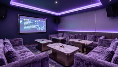 Intimate lounge area with soft velvet sofas in dusty slate, perfect for a quiet evening with friends, lit by warm yellow lamps.