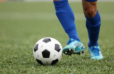 Close-up of a soccer player's feet with a ball on a green turf, focus on precision and technique, brand colors #1A2B3C and #8FAABF present.