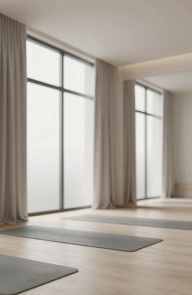An elegant, minimalist indoor yoga studio with floor-to-ceiling windows and soft #5D7E8C curtains.