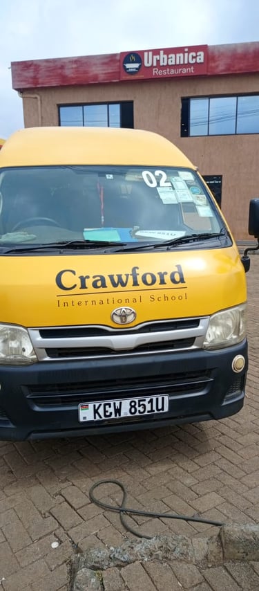 Yellow school van for Crawford International School from Vanna Ventures