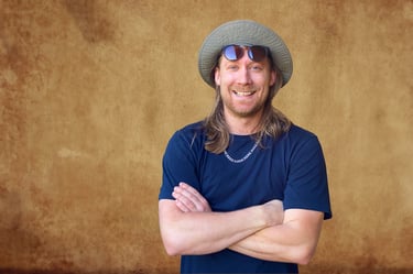 Relaxed adult man now portrait with warm backdrop, Perth portrait photographer Fisher Photography