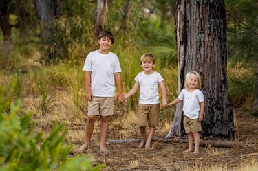 Three brothers standing in Perth bushland landscape, children's family photography by Fisher Photography