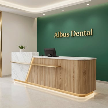 Modern Albus Dental clinic reception with a sleek wood and marble desk, green accent wall, and elegant gold lettering