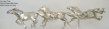 a group of silver horses galloping, with the last becoming pixelated