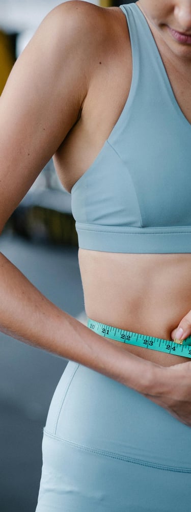 a woman in a blue top and measuring tape measure tape