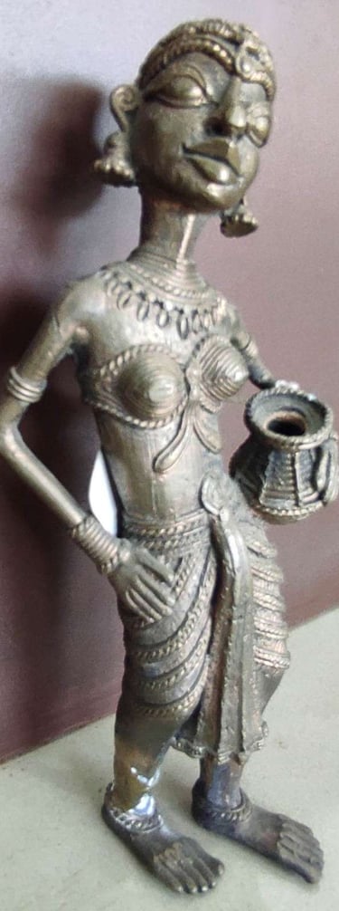 "Handcrafted tribal woman statue holding a water pot, standing in elegant pose-Globally tradable"