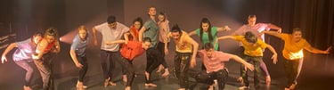 a group of people standing around a stage