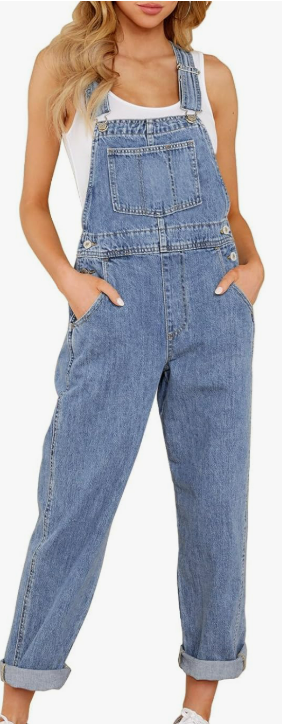 a woman wearing denim overalls with white tank top under