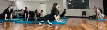 a group of people doing yoga exercises on their mats