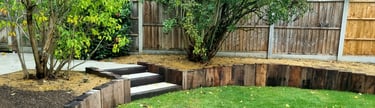 800m2 Full Garden Remodel Curved Sleeper Retaining Wall Planters, Lawn & Split-face Tiled Wall Step