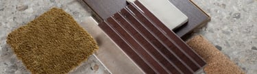 Interior design mood board featuring terrazzo tile, dark wood flooring, and olive green carpet samples.