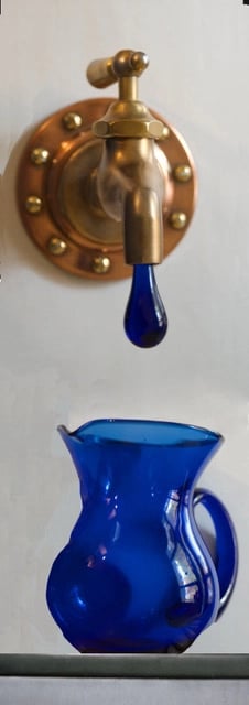 Talbotics wall mount faucet with glass drip at home in Westchester, New York.