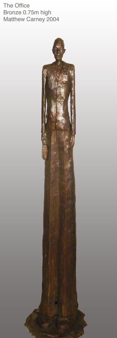 a statue of a man in a suit and tie