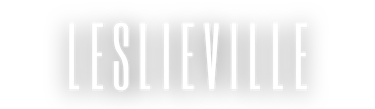 Leslieville neighborhood logo in white tall sans-serif typography on a black background.
