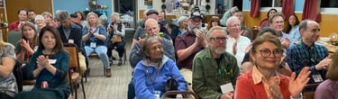 Audience applauding after a talk at a chapter meeting