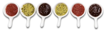 Sustainable plant-based sauces displayed in small white dishes