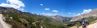 a group of people riding bikes down a mountain