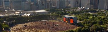 a large crowd of people standing in front of a large building