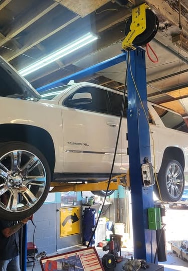 a white truck is parked in a garage