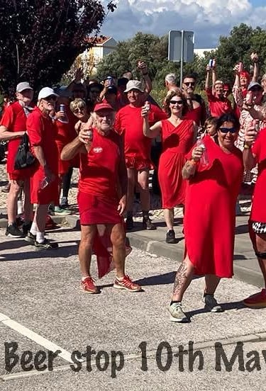 A group of Hashers dressed for red dress run