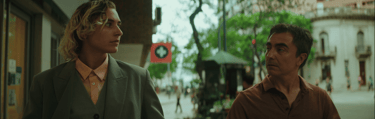 Felix and Alex walking through downtown Córdoba, illustrating a pivotal moment of connection.
