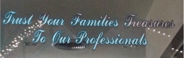 A window decal reading: "Trust Your Families Treasures To Our Professionals"