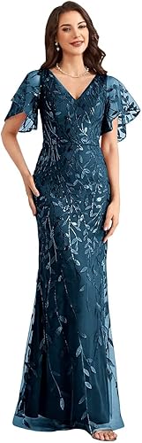 A woman models a floor-length, teal/dark blue formal gown with butterfly/flutter sleeves. The dress 