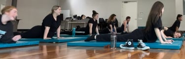 a group of people doing yoga exercises on their own mats