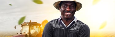 a man in a hat and a hat on a farm