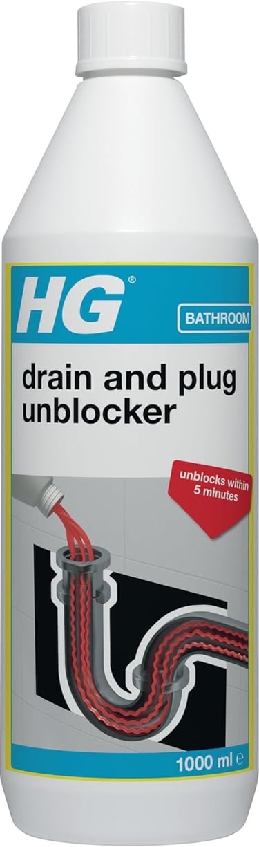 a bottle of liquid in a bathroom with a drain