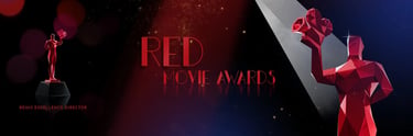 a red statue of a woman holding a rose
