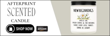 a bottle of new beginnings scented candle with a white background and a black and white