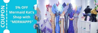 several mermaid tails hung at the wall, representing MerMaid Kat's shop and the 5% discount you get