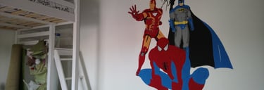 superhero mural painting in a room