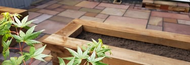 Colourful Sandstone Paving & Wooden Planters