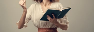 a woman very excited, holding her book