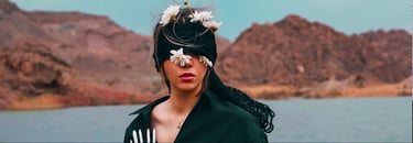 a woman with a hat and a black jacket